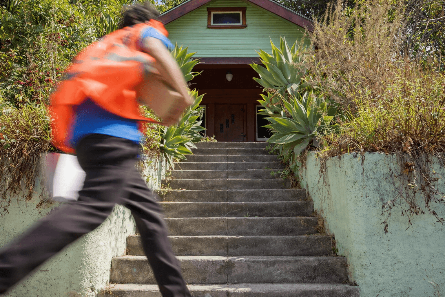 Delivery driver making a residential doorstep delivery